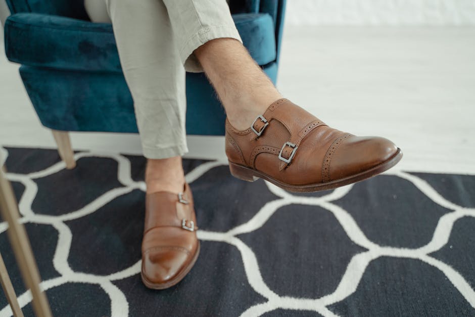 Close-up of stylish brown leather shoes with double buckles, perfect for modern fashion and elegance.